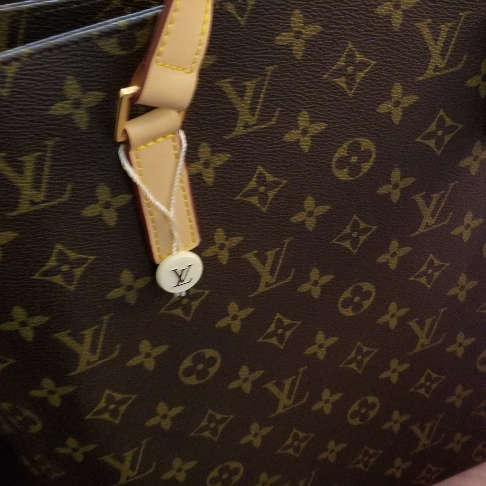 A brown vintage Louis Vuitton purse